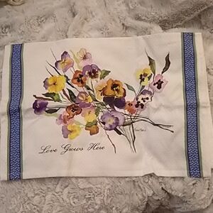Pansy Tea Towel with "Love Grows Here" in Cursive on Lower Left Front